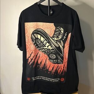 Obey Black Tee with Striking Red and Orange Boot Design